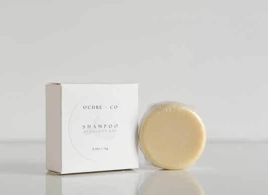 Ochre & Co shampoo bar and packaging on a light gray background