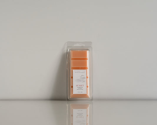 Packaged wax melt labeled 'Sunset' on a soft white background