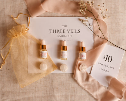 Three Veils sample kit with bottles and packaging on a textured surface