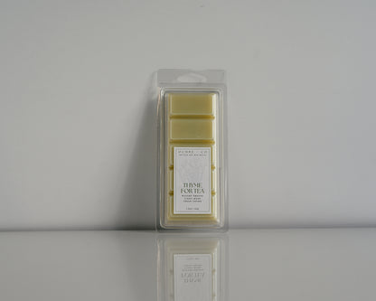 Thyme for Tea wax melt on a white background and reflective surface