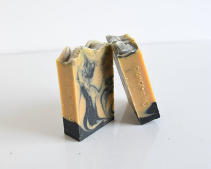 Two bars of soap with a marbled pattern on a white background