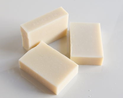 Three rectangular bars of soap on a white background